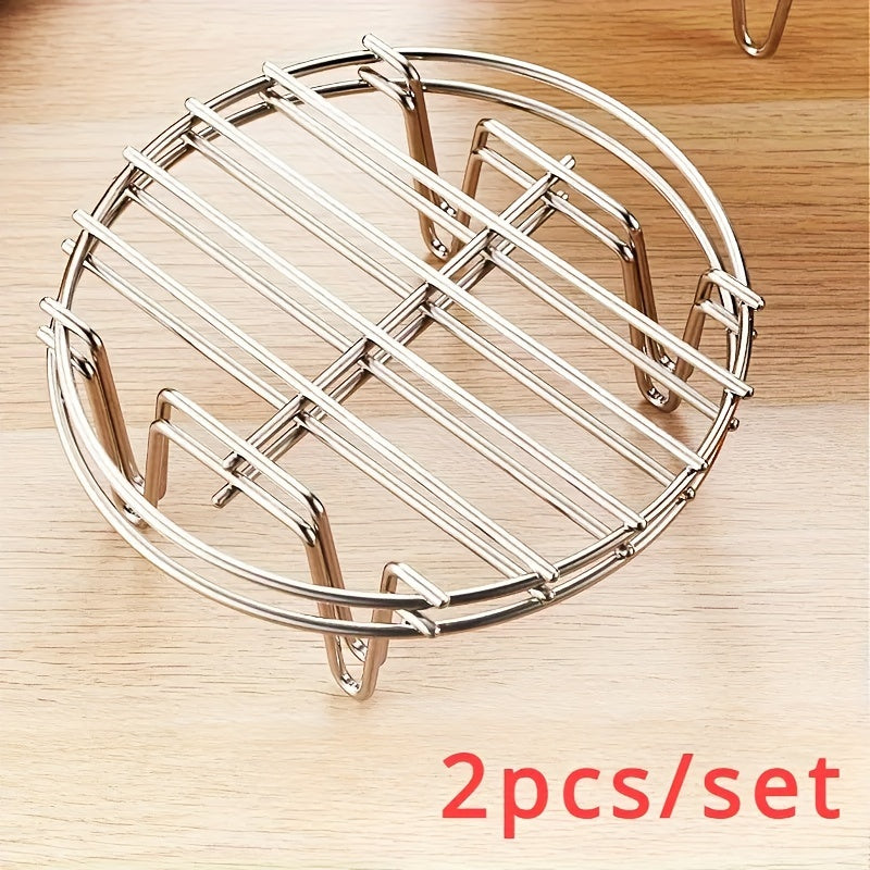 Two pieces of stainless steel steamer racks with an elevated 4-corner design, perfect for healthy cooking and essential kitchen accessories.