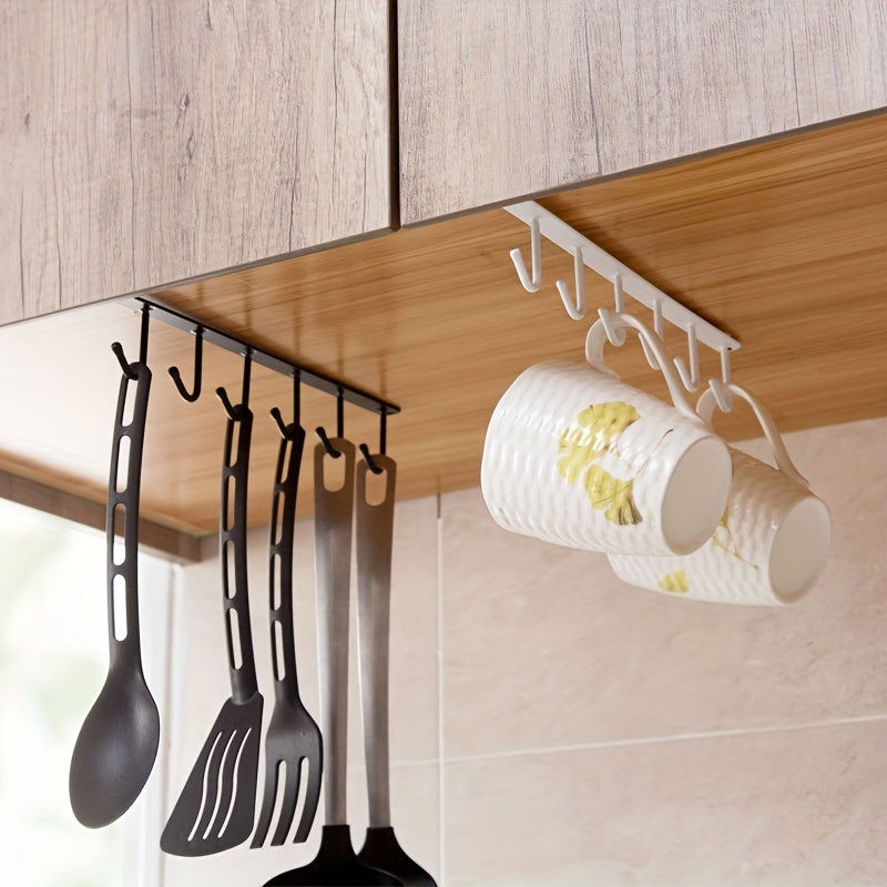 Keep your kitchen cups, mugs, and utensils organized with this durable iron under cabinet hanging storage organizer. Includes 6 detachable hooks for easy access. Perfect for saving space in your home or office.