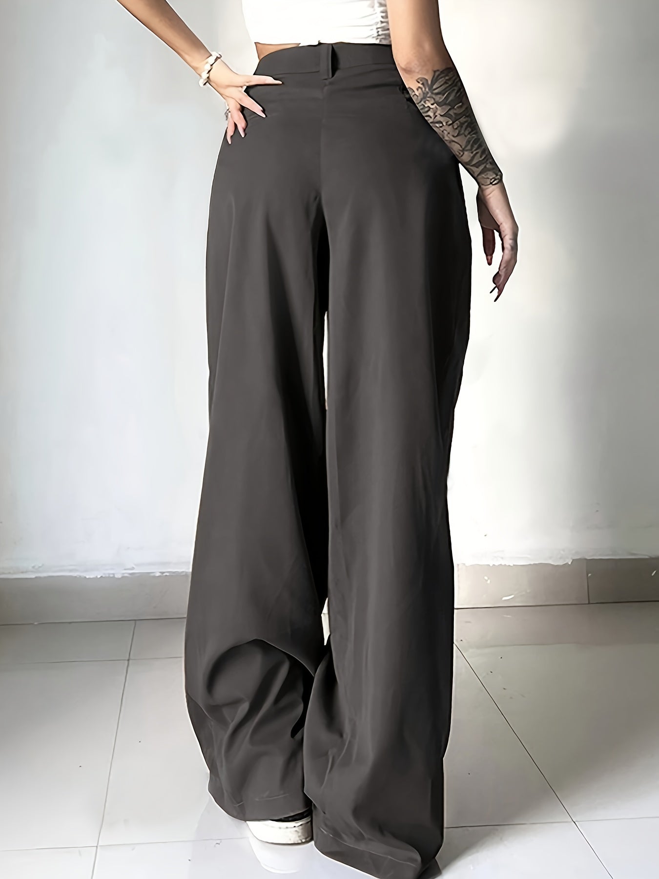 High-waisted button-front work pants in solid colors for women's office attire.