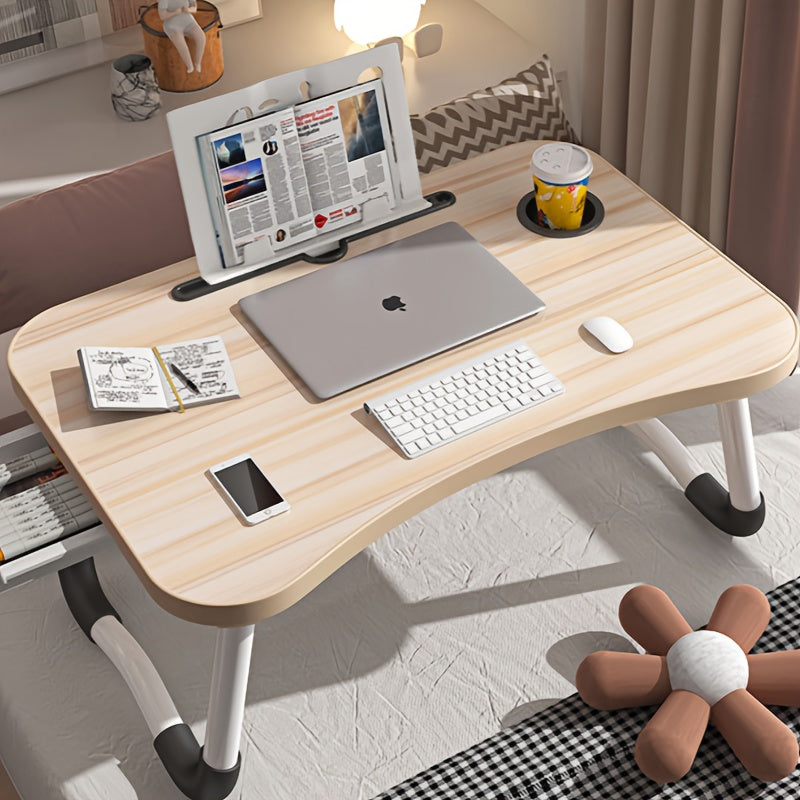 Large portable laptop desk with folding design, featuring multifunctional tray, cup holder, drawer, USB port, fan, and light. Made of durable aluminum alloy, suitable for use on bed, sofa