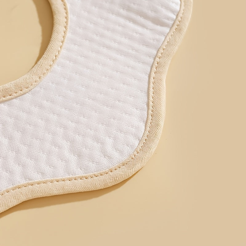 Five-pack of baby bibs made from cotton with a waterproof layer and snap closure. These breathable muslin drool bibs are perfect for newborns and infants aged 0-3 years. Featuring a unisex petal-shaped design.