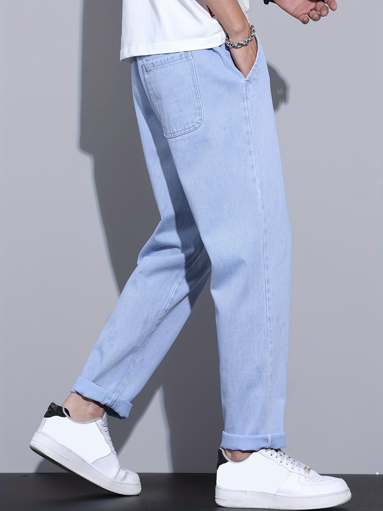 Men's light blue drawstring waist straight-leg jeans in glossy fabric, perfect for all seasons.