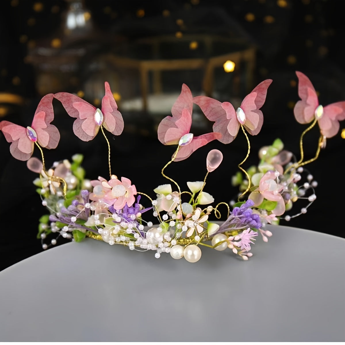 Hair accessories for women featuring a flower headband with butterfly decoration, faux pearl inlays, and a wreath design