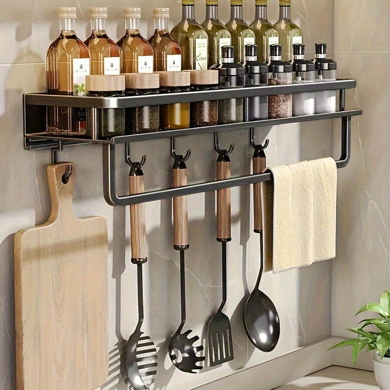 Metal storage for bathroom toiletries that does not require drilling, featuring a spice rack, utensil holder, and towel bar, all in one wall-mounted kitchen organizer.