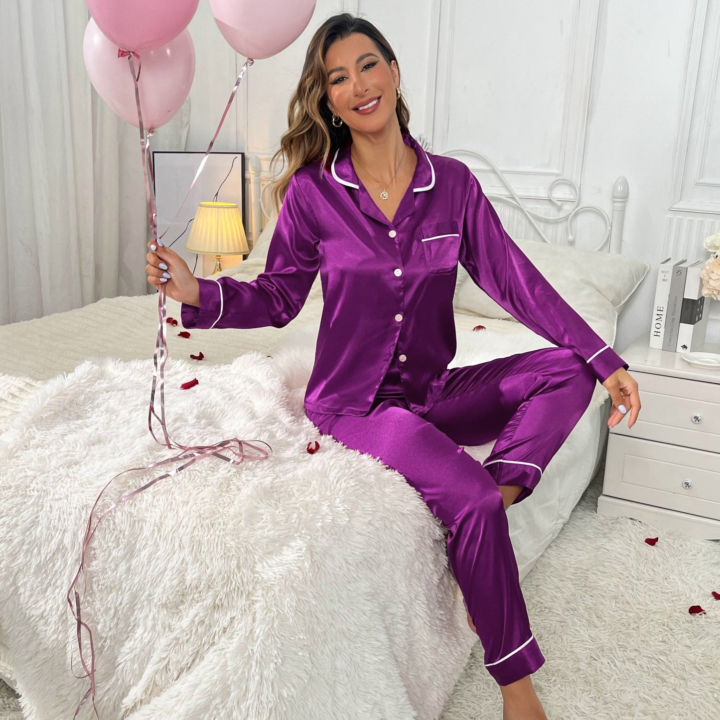 Women's sleepwear: Solid satin pajama set with button-up top and elastic waistband pants. Comfy and stylish loungewear.