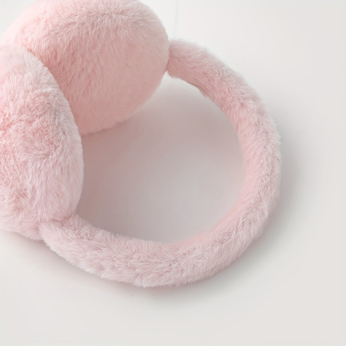 Keep cozy and stylish with these adorable Pink Heart Plush Earmuffs - perfect for daily use during the cold winter months. Made with thick materials, they provide excellent warmth and protection for your ears during outdoor activities.