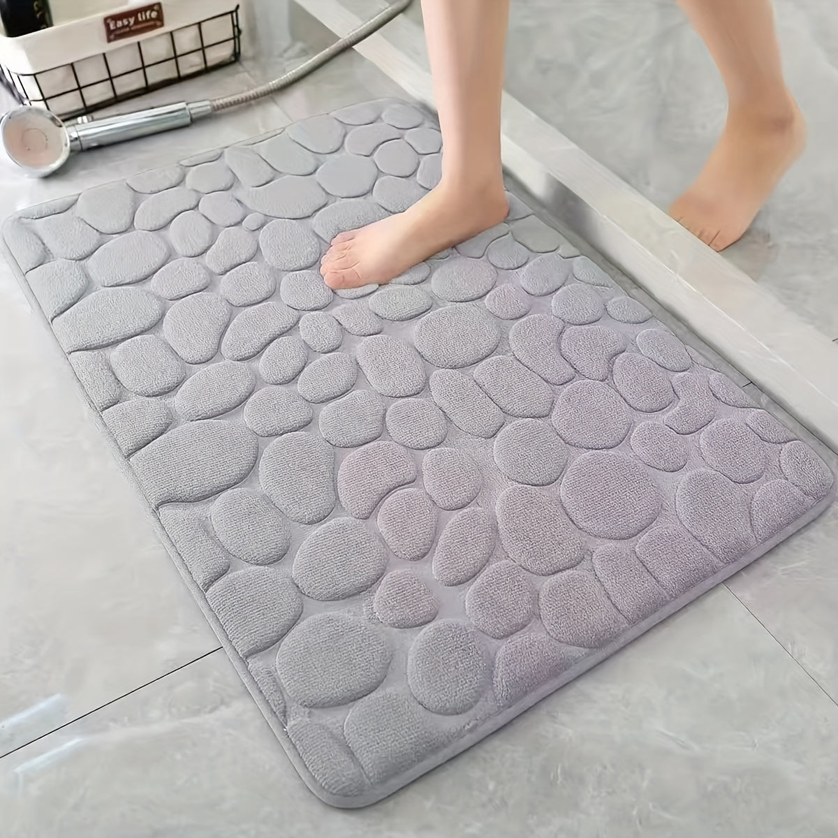 Pamper Your Feet with our Luxurious 3D Pebble Design Bath Rug! This Quick-Dry Non-Slip Bathroom Mat is made of Soft and Comfortable Polyester Memory Foam. It is Woven with a density of 700gsm and is 1.5cm Thick. Perfect for Home Decor and as Holiday