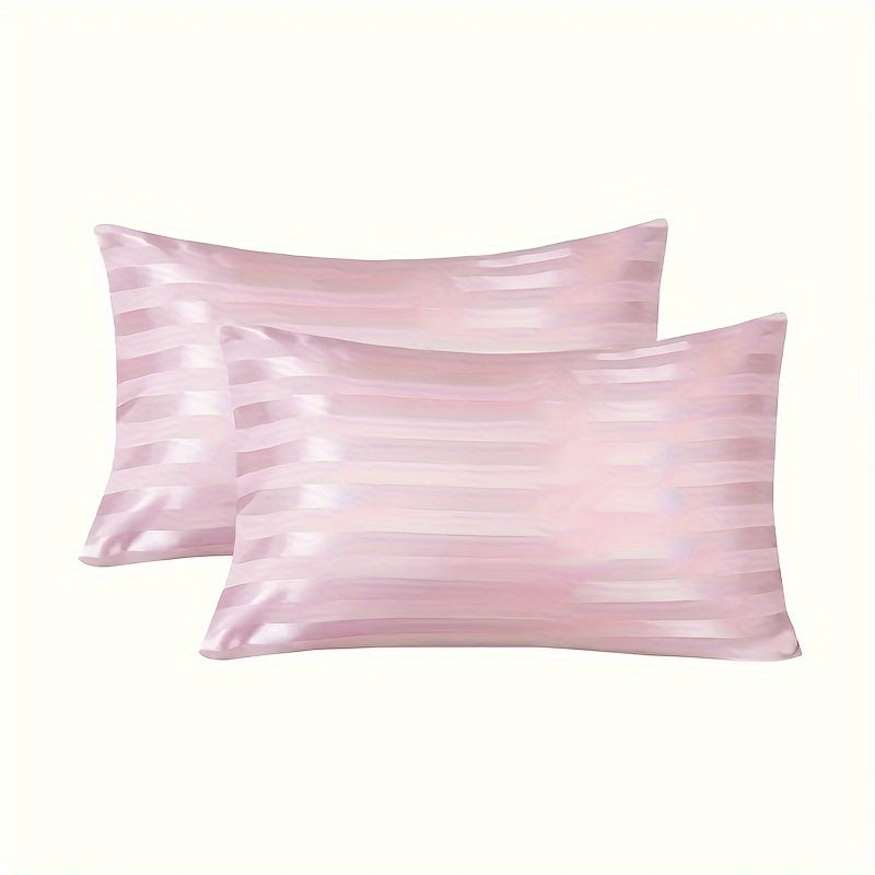 Black pillow cover for bed made of hypoallergenic polyester with a satin stripe design. Machine washable and wrinkle resistant.