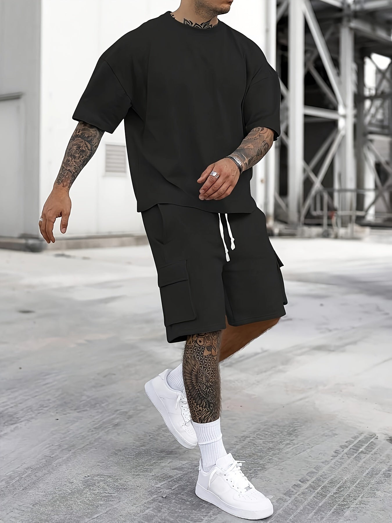 Men's casual sportswear set includes polyester t-shirt and drawstring shorts with pockets, ideal for summer and machine washable.