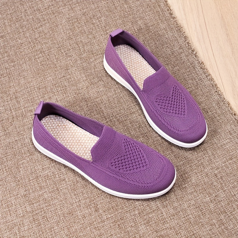 Women's slip-on flats with comfortable fabric upper, flax insole, and faux sole for easy daily wear.