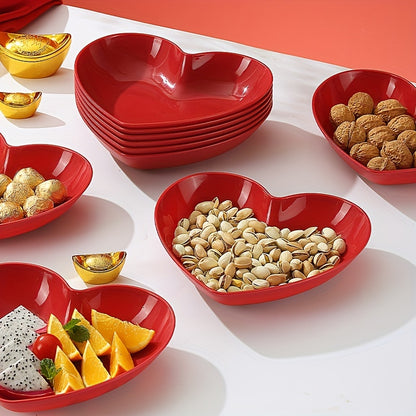 Heart-shaped plastic serving saucers in red for special occasions.