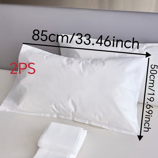 Two pieces of sterile disposable travel pillow covers with sealed envelopes. They are partially cleaned, pure white, and made of thick breathable non-woven polyester. Ideal for travel, hotels, and salons. The covers are unprinted and come in a pair. Use