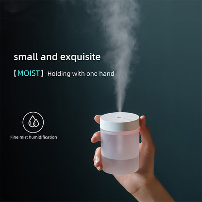 Compact 200ml Soundwave technology humidifier with USB power, featuring fine mist, atmosphere light, and a handy carry handle - perfect for all room types.