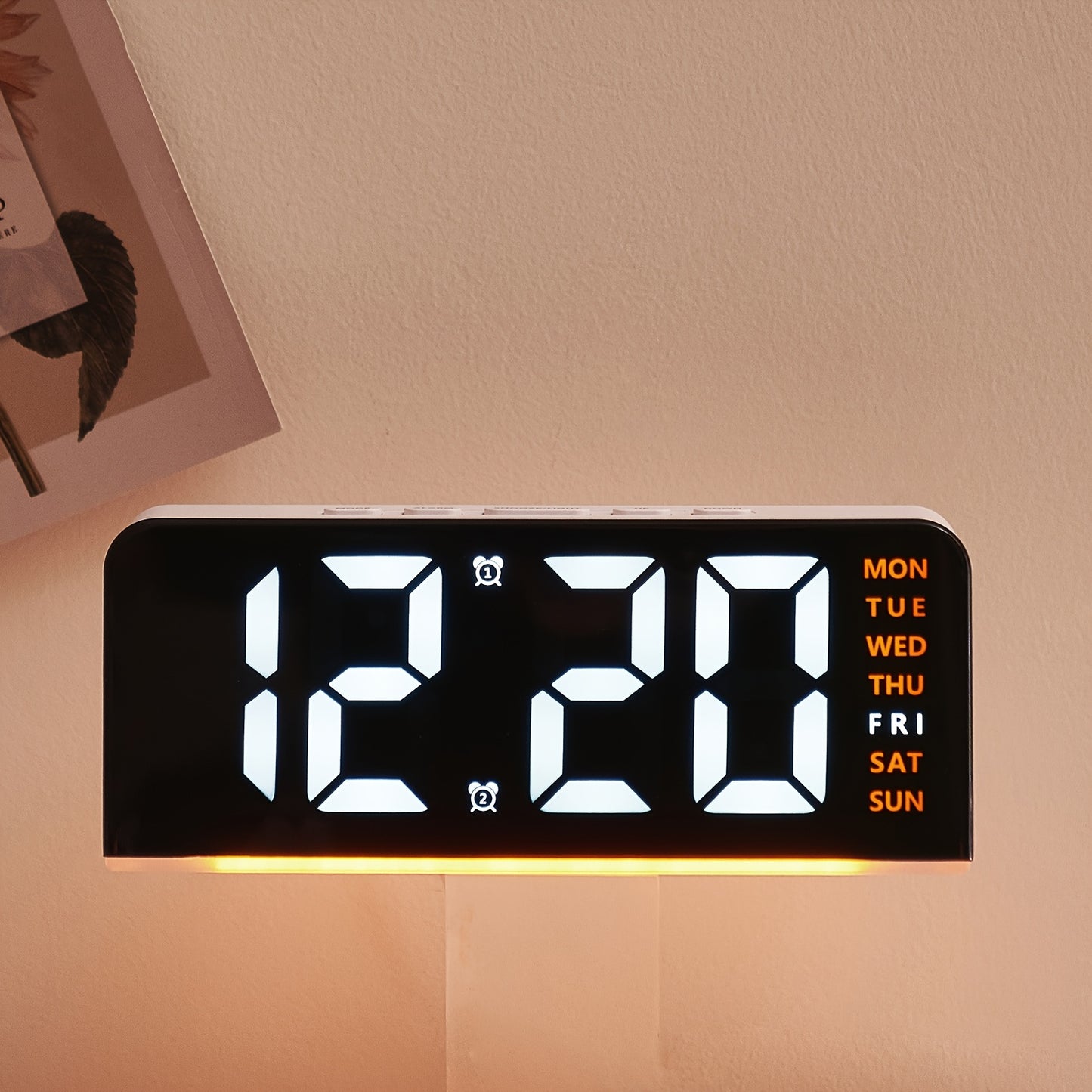 Digital LED Alarm Clock with USB power, sleek black plastic frame, dual time display, modern design for bedroom decor. Battery-operated (AAA not included).