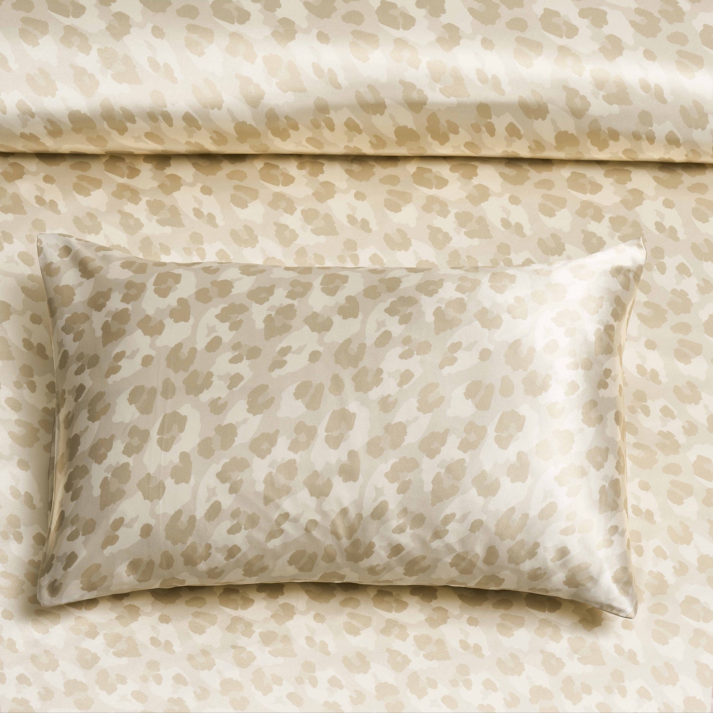 Two pieces of satin pillowcases with leopard print design