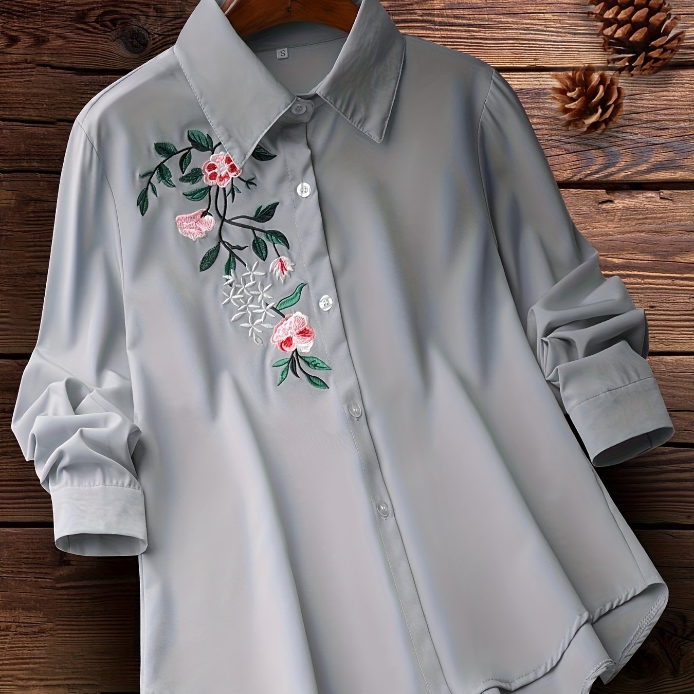 Embroidered floral button-up shirt for women, perfect for spring and fall.