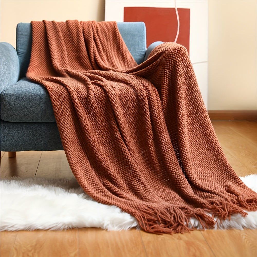 Stay cozy and stylish with this elegant knit throw blanket, featuring tassels for added flair. Made of lightweight acrylic with a bubble textured design, this blanket offers all-season comfort. Perfect for use on the couch, bed, or as home decor, as well