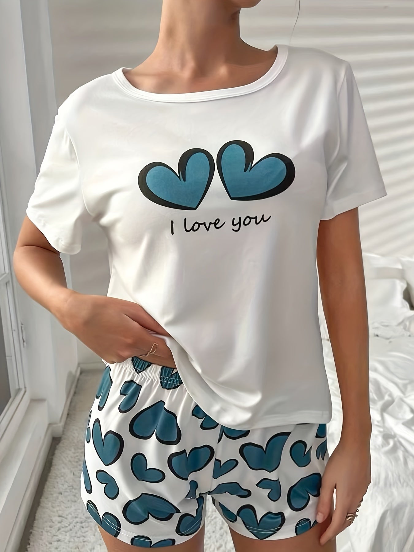 Women's Heart Print Pajama Set with Crew Neck Top and Elastic Waistband Shorts for Sleepwear and Loungewear.