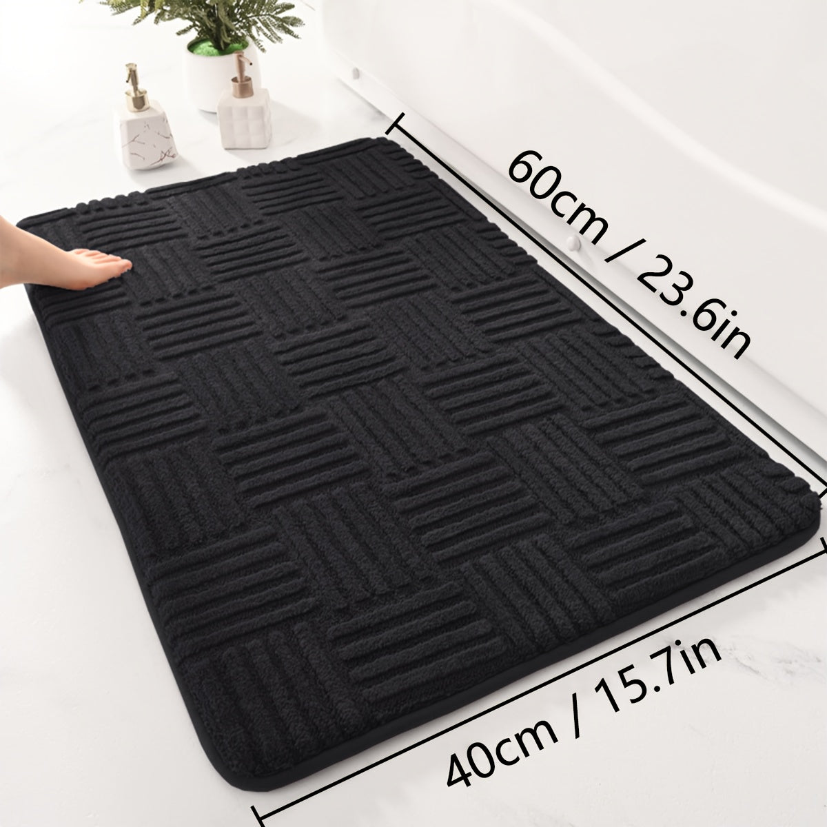 One piece of a thickened bathroom absorbent mat with a non-slip bathtub rug. Can also be used as a home entryway carpet with a solid color and stripe pattern. The mat is rectangular in shape and lightweight, machine-made with a PVC backing. Made of