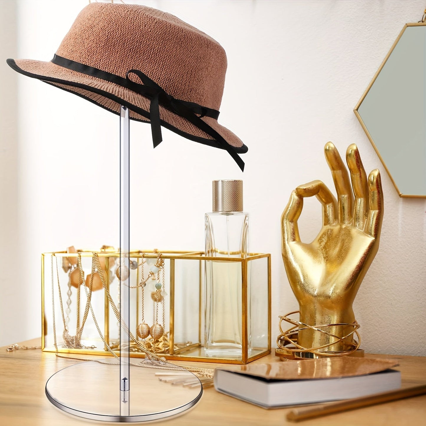 Introducing our sleek and minimalist 1pc Clear Acrylic Hat Display Stand. This freestanding and portable storage rack is perfect for organizing bucket hats, baseball caps, and wigs. With no electricity needed, it is ideal for use in the bedroom