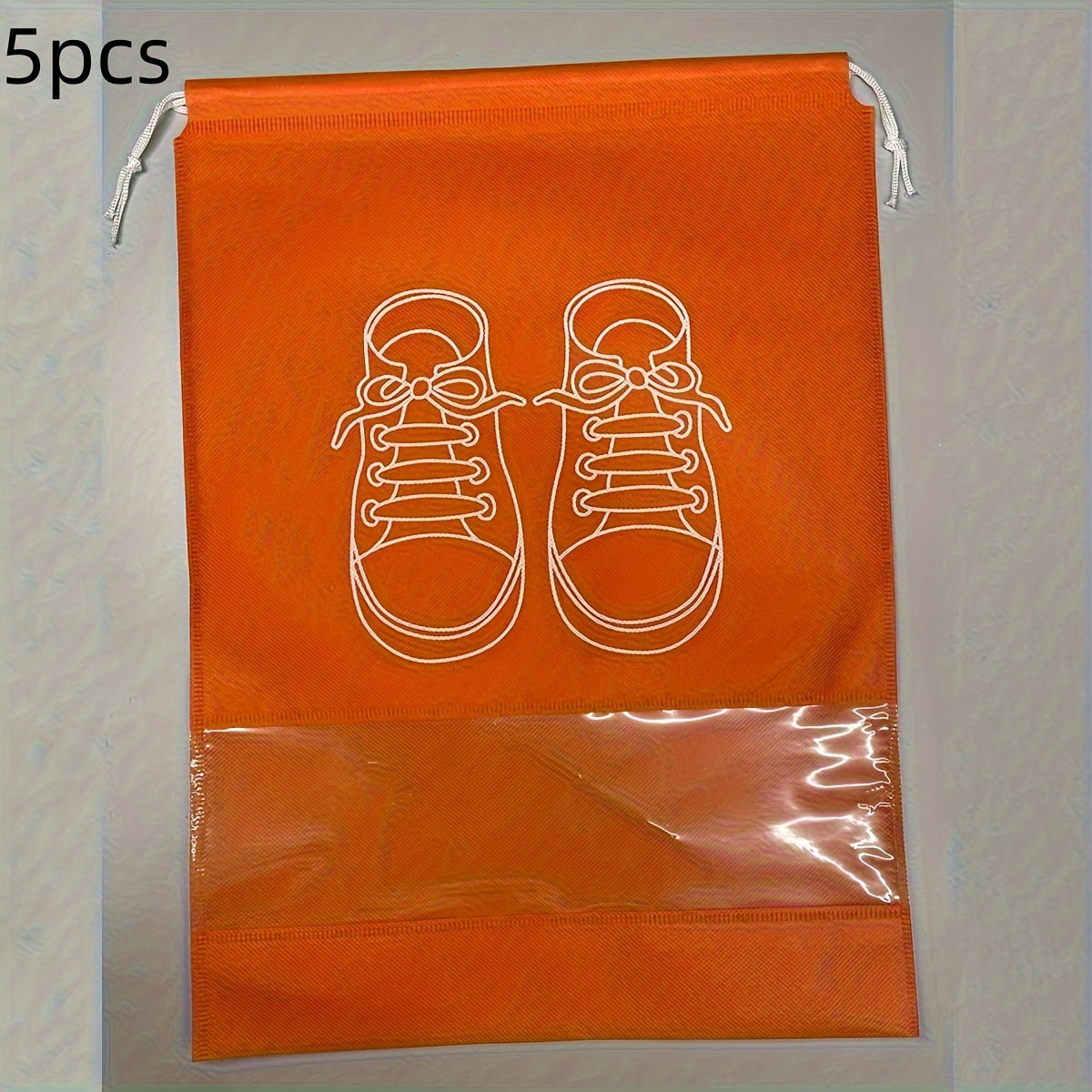 5 Portable shoe storage bags with drawstring made of waterproof, non-woven fabric for travel and closet organization.