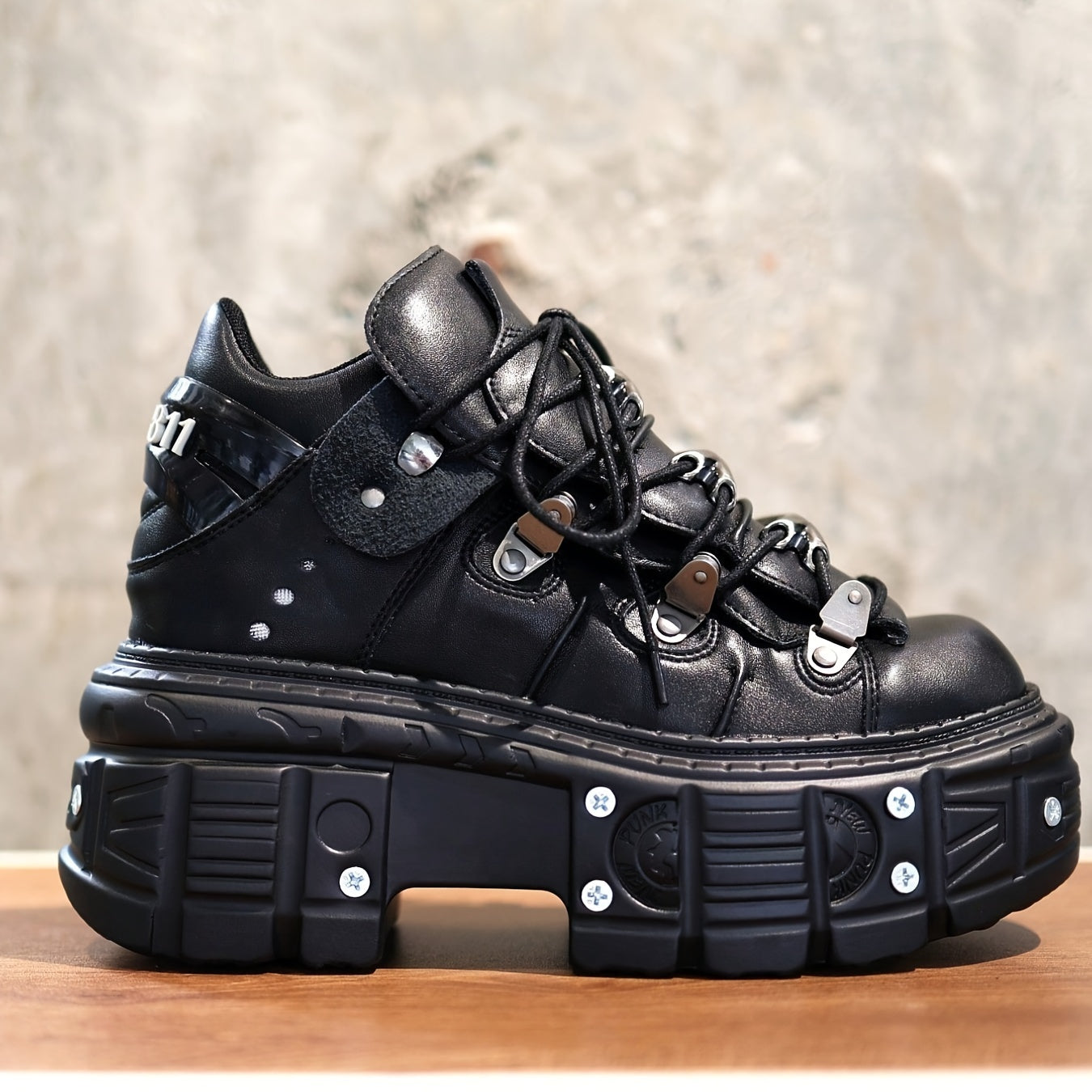 Black women's mid-top sneakers with metallic accents, waterproof, thick platform sole, lace-up Y2K goth style.