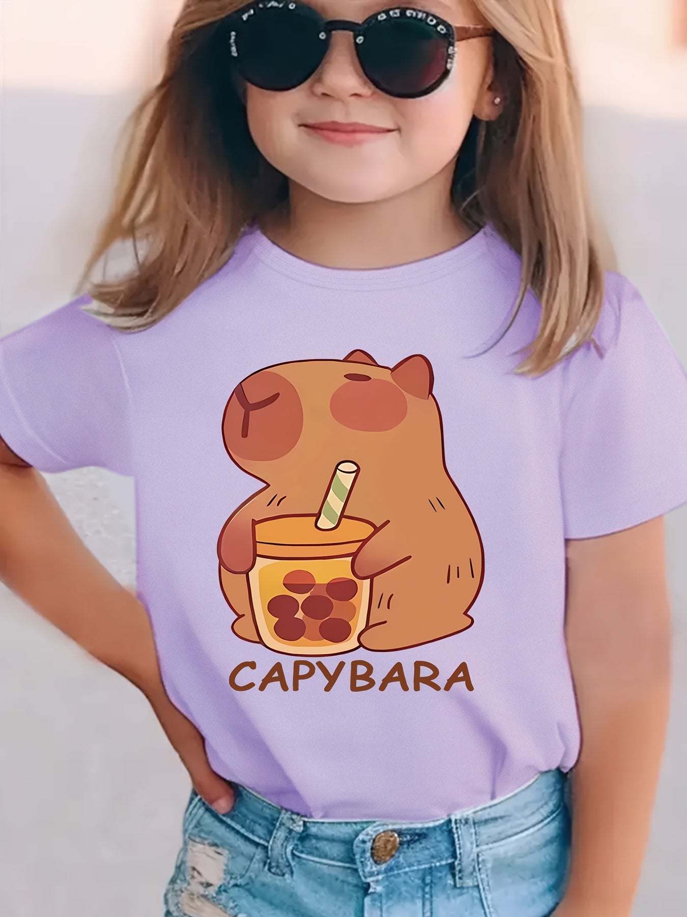 Girls' cozy round neck t-shirt with capybara drinking milk tea pattern, perfect for spring and summer.