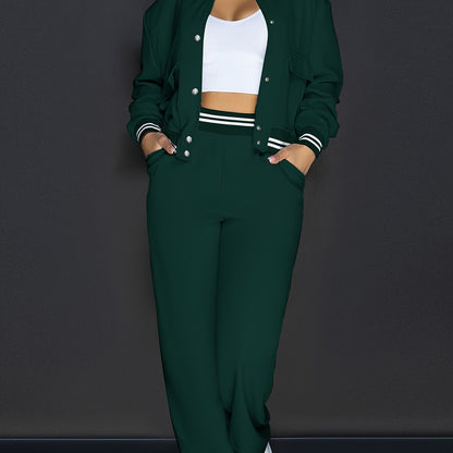 Stylish green two-piece set for women, perfect for vacation. Includes crop top bomber jacket and straight-leg pants with pockets. Made of stretchy polyester and elastane blend that is