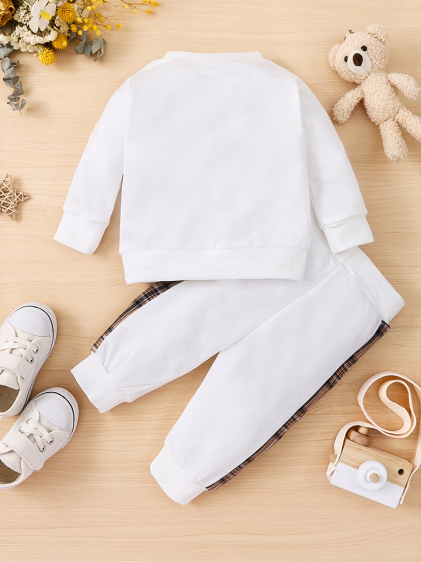 Toddler boy's outdoor fall/winter outfit with long sleeve sweatshirt and casual pants.