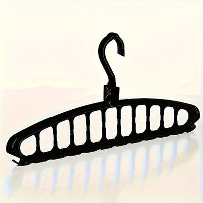 Versatile plastic travel hanger saves space with horizontal and vertical hanging capabilities.