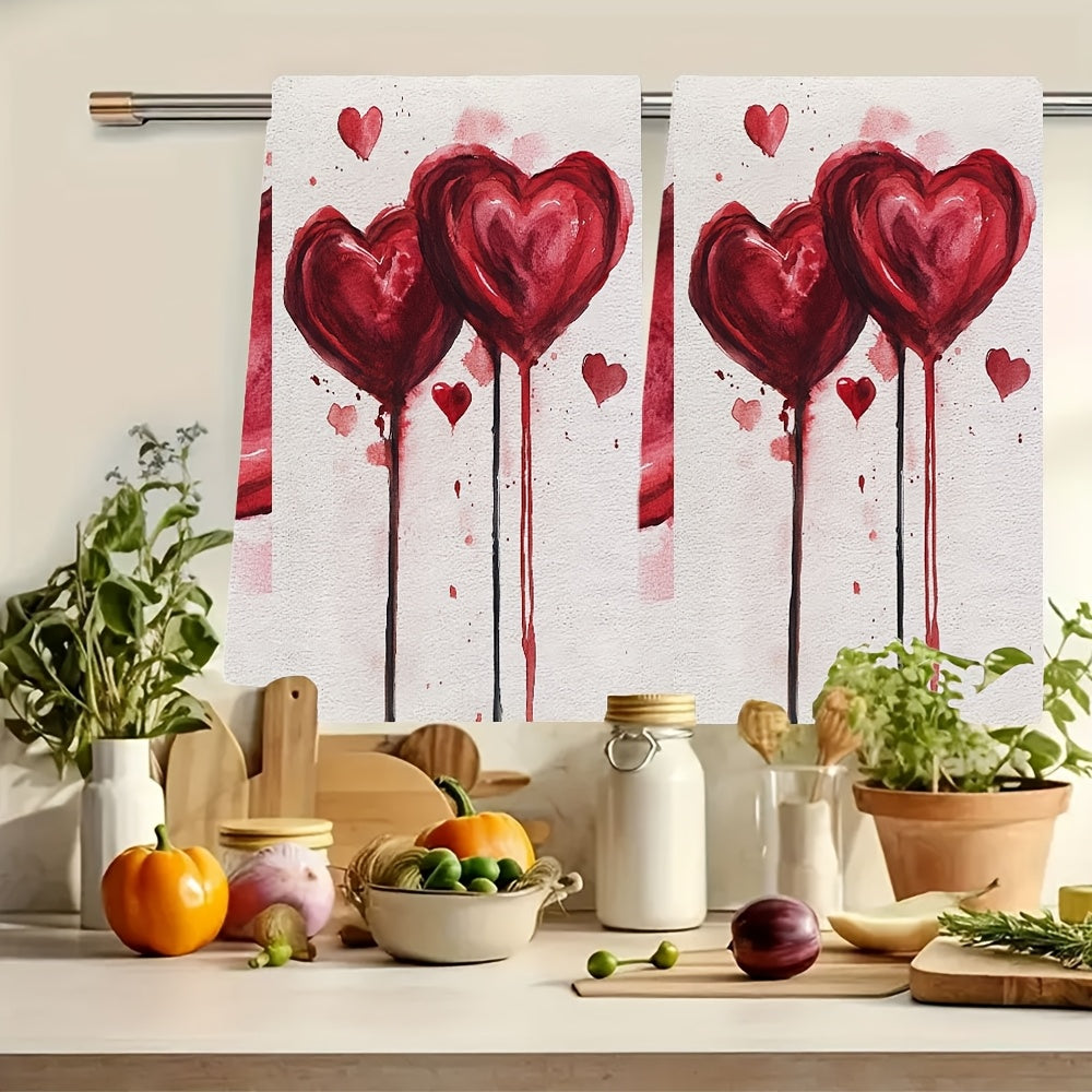 Two pieces of ultra soft kitchen towels featuring a Valentine's Vibes heart design. These towels are highly absorbent, machine washable, and perfect for drying dishes. With a contemporary style, they measure 40.64x60.96 cm each.