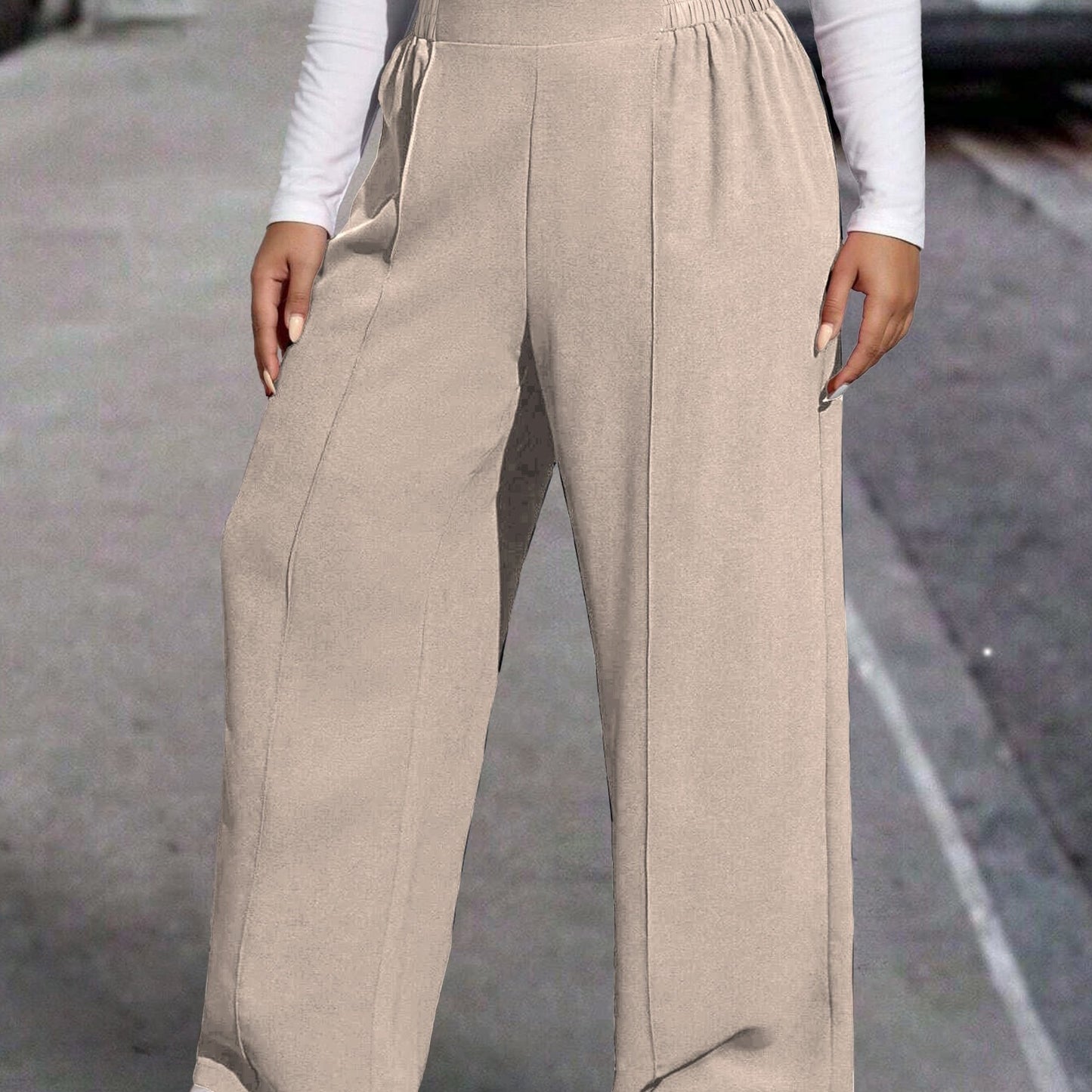 New stylish large women's pants, extended and loose fit, comfortable and light, in a sleek solid color.