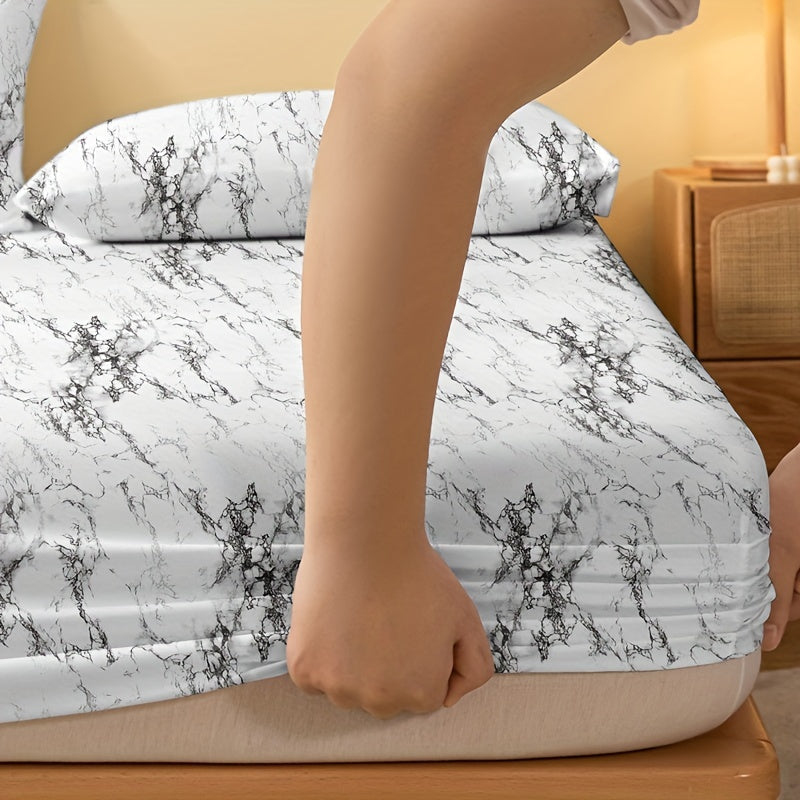 Get cozy with our 1 piece Brushed Fitted Sheet in a soft and comfortable marble print. This bedding essential is perfect for your bedroom, guest room, or any space needing a touch of luxury. Featuring deep pockets for a secure fit, this fitted sheet is