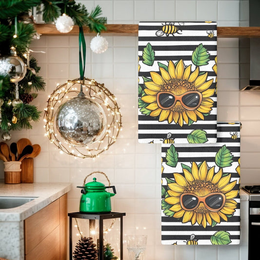 Two pieces of contemporary dish cloths featuring a sunflower pattern, made of woven polyester material. These oblong kitchen towels are designed with a floral theme and are suitable for hand wash only. Ideal for use in the kitchen.