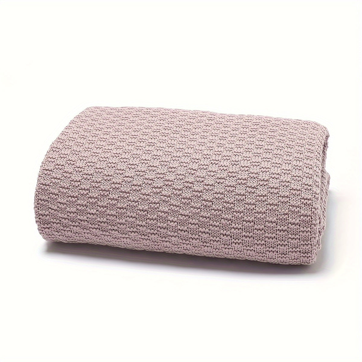 Dreamwrap is an ultra-soft knit blanket designed for youngsters. This solid color blanket is perfect for use in cribs and strollers. It is recommended to hand wash only. Available colors include gray, white, and pink.