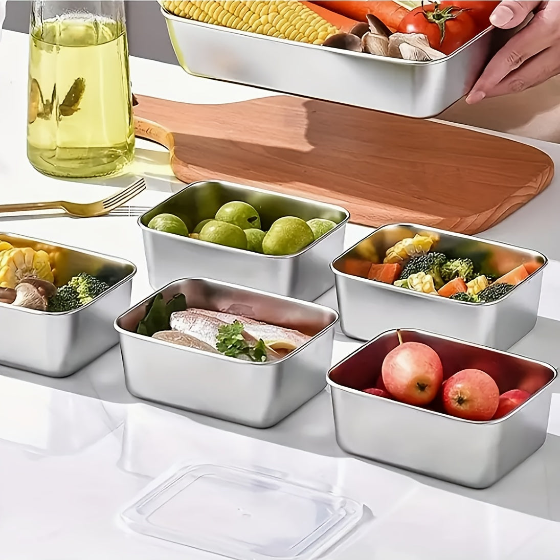 Set of three stainless steel food storage containers with lids - square shape, manual operation, no electricity required - ideal for use in the kitchen and dining area.