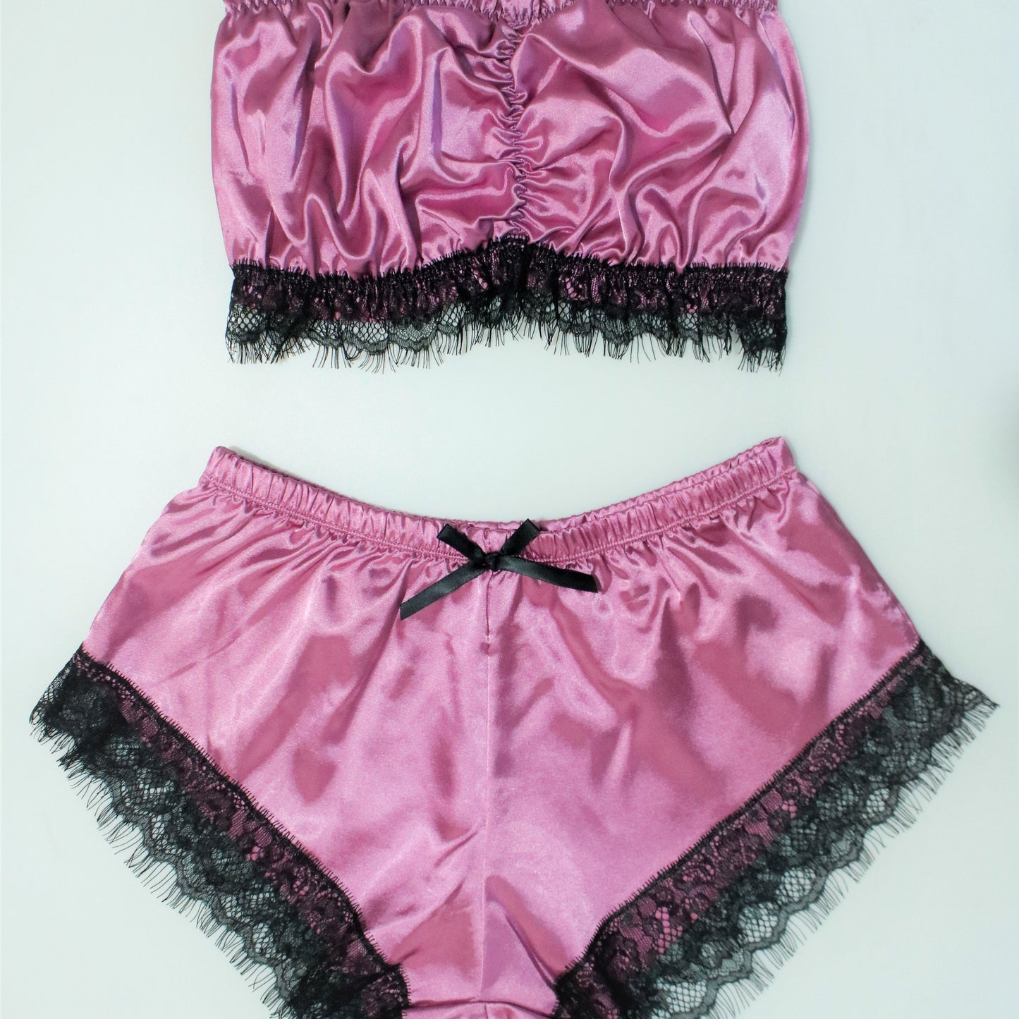 Women's sleepwear with lace trim pajama set and satin tube tops with shorts.