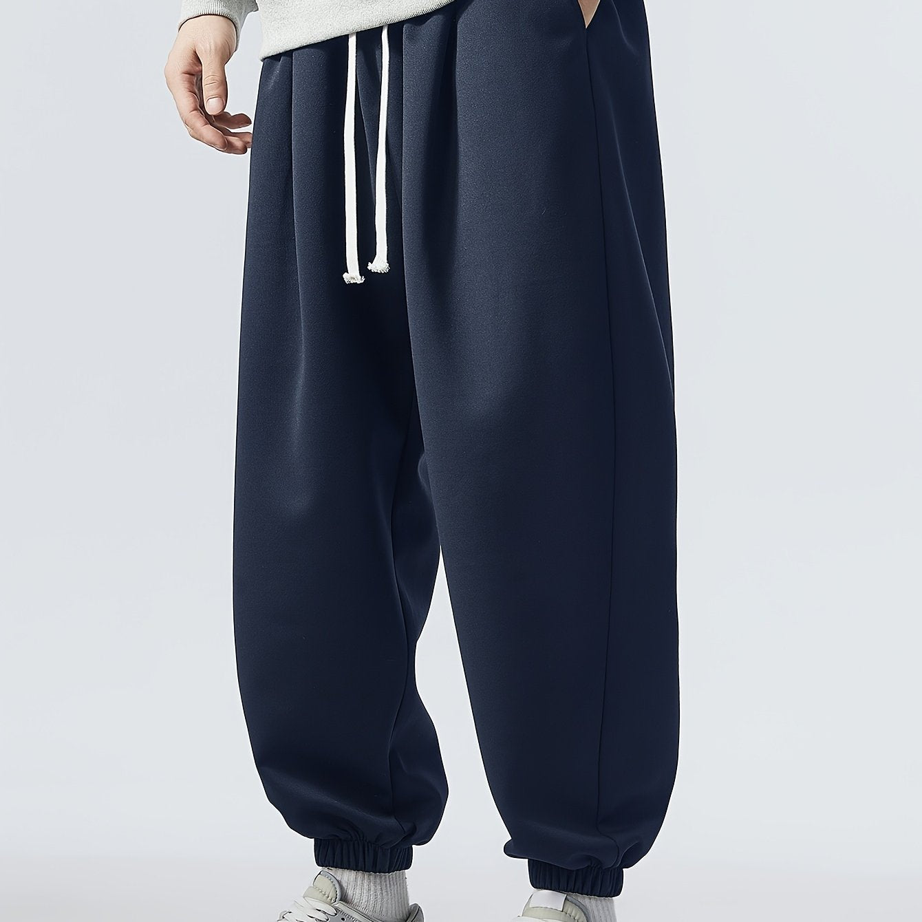 Loose fit, striped sweatpants for men, plus size, made of polyester blend with elastic waistband and drawstring. Machine washable for year-round comfort.