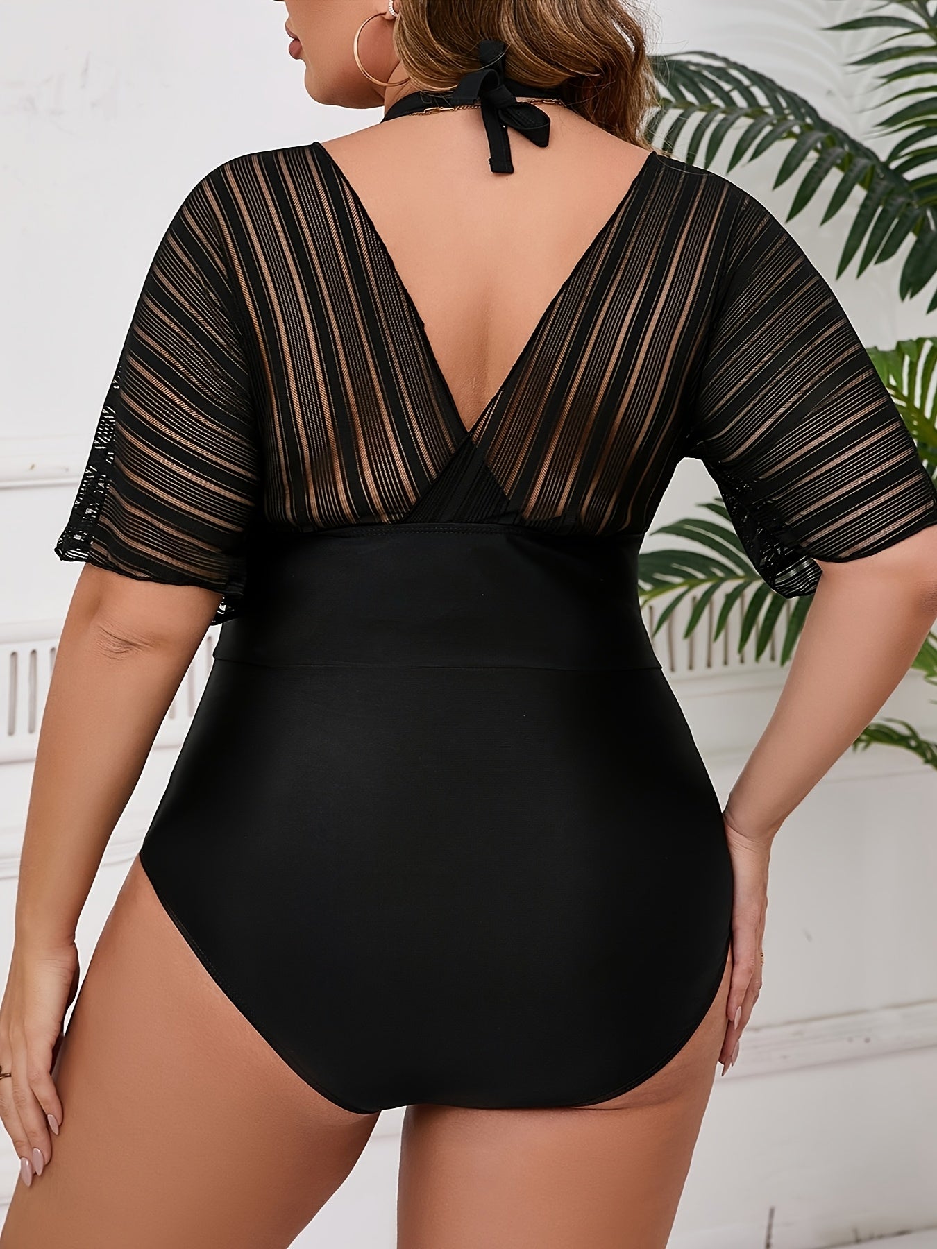 Stylish plus size women's one-piece swimsuit with matching cover-up. Features V-neck, high stretch, removable pads, machine washable.