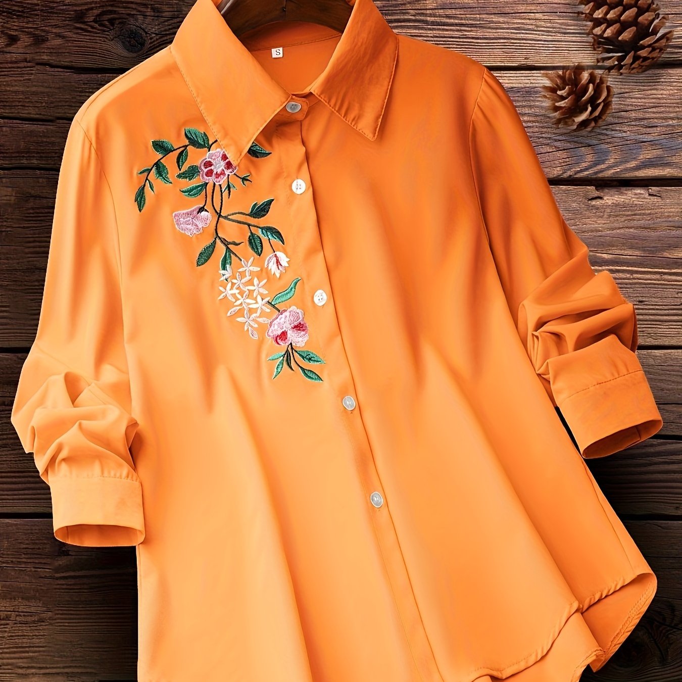 Embroidered floral button-up shirt for women, perfect for spring and fall.