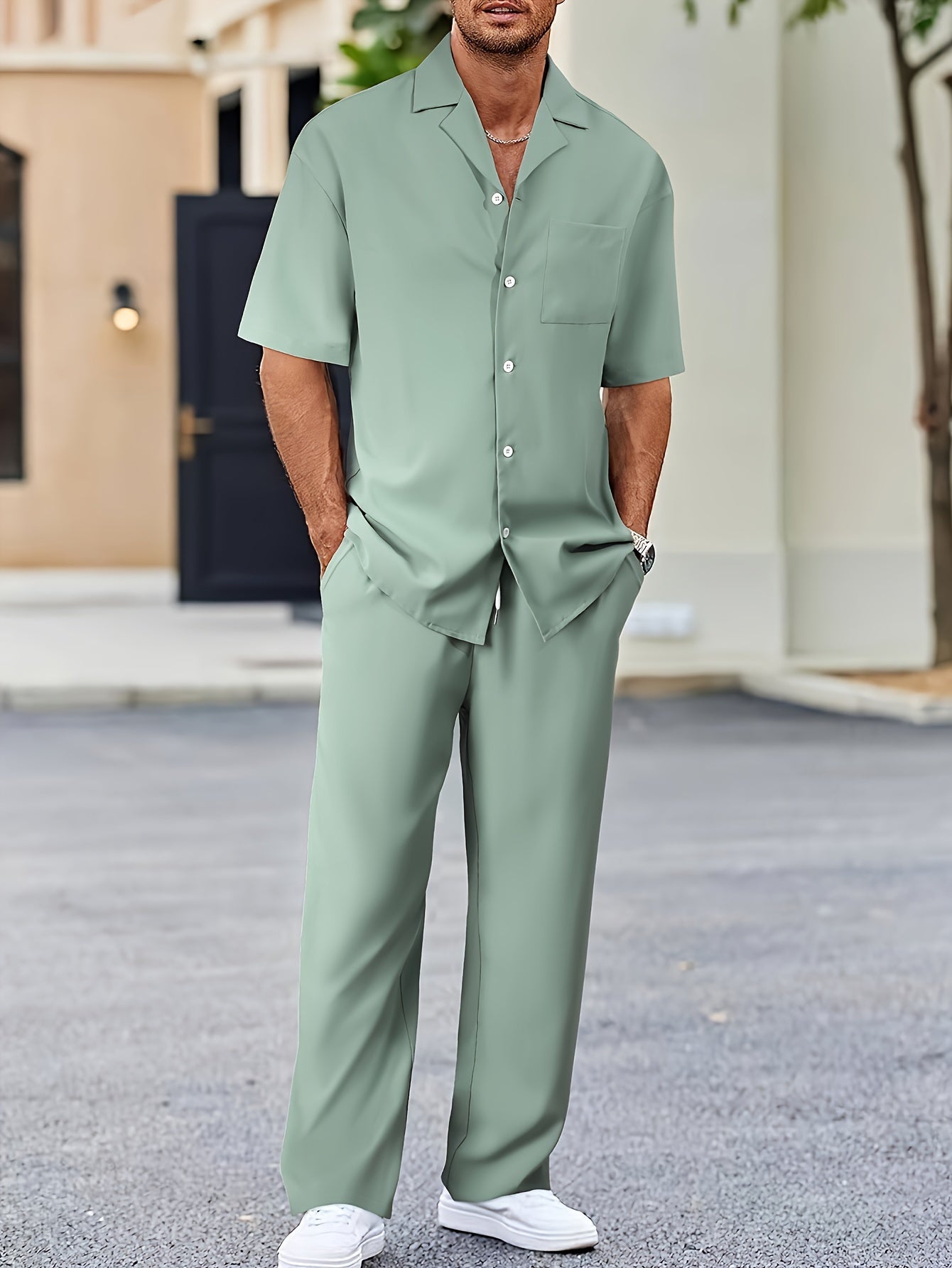 Men's casual suit-inspired set includes short sleeve shirt and loose straight pants made of polyester, machine washable.