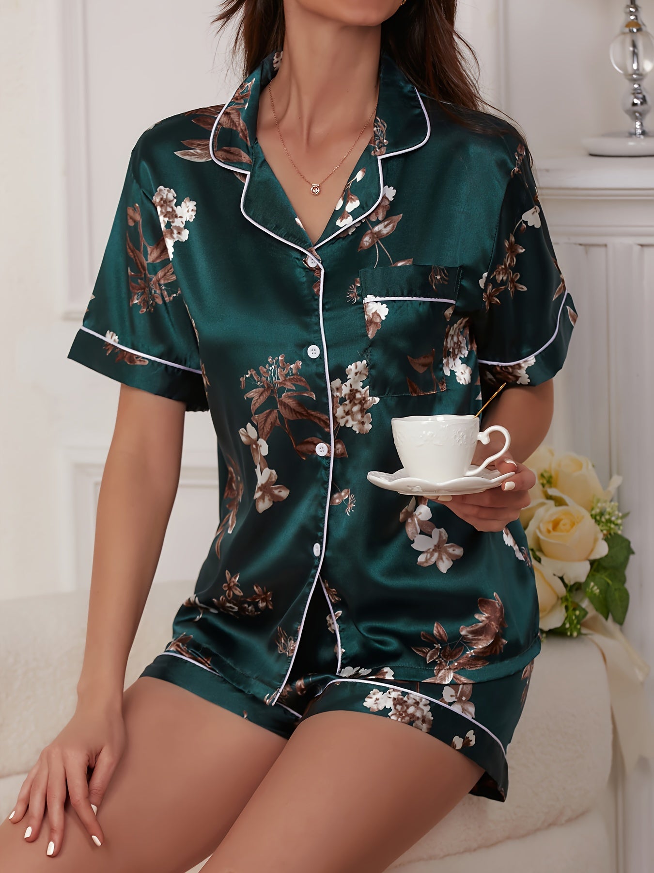 Butterfly print satin pajama set with short sleeves and shorts for comfort and leisure.