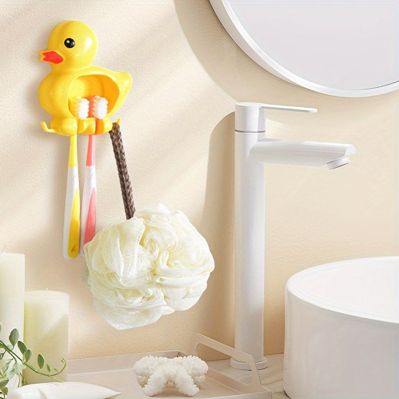 Wall-mounted toothbrush holder with cute duck design, waterproof plastic organizer with suction cup, no-drill installation, home decor.