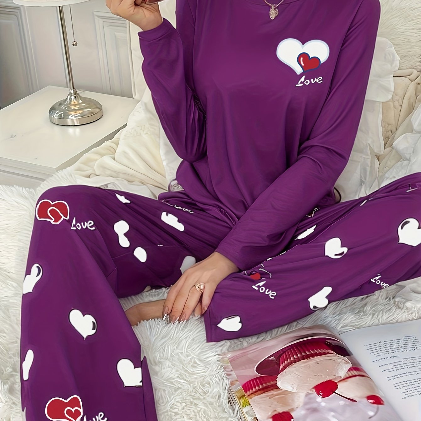 Women's heart print 2-piece pajama set includes long sleeve crew neck top and elastic waist pants in cozy polyester blend for fall/winter.