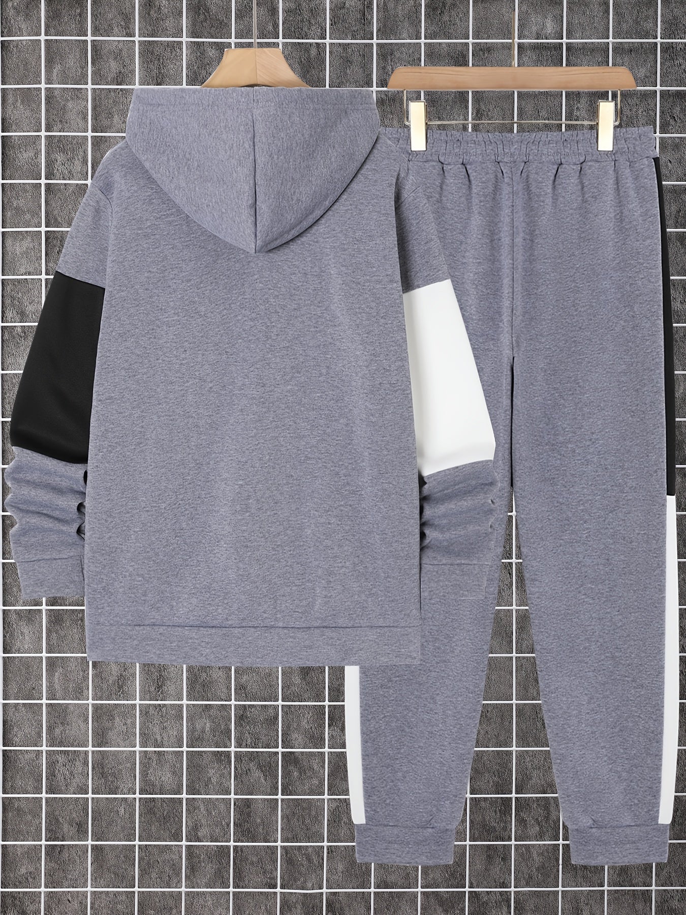 Men's 2-piece color block athletic tracksuit with long sleeve zip up hoodie, drawstring, and jogging pants for gym workouts and running.