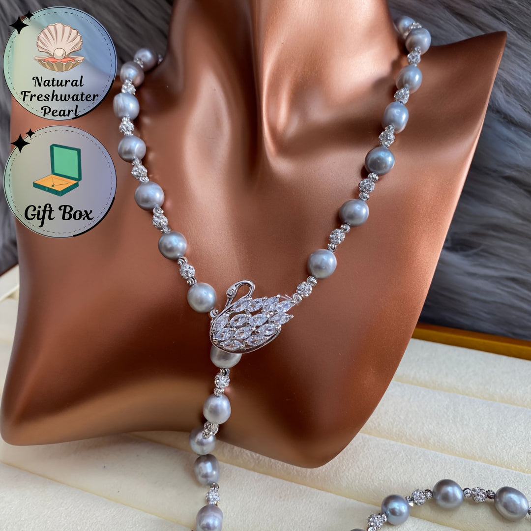 This sophisticated Baroque freshwater pearl Y-necklace features a swan clasp in a silvery gray hue, making it the ideal accessory for fall and winter fashion. It also makes for a perfect Thanksgiving gift.