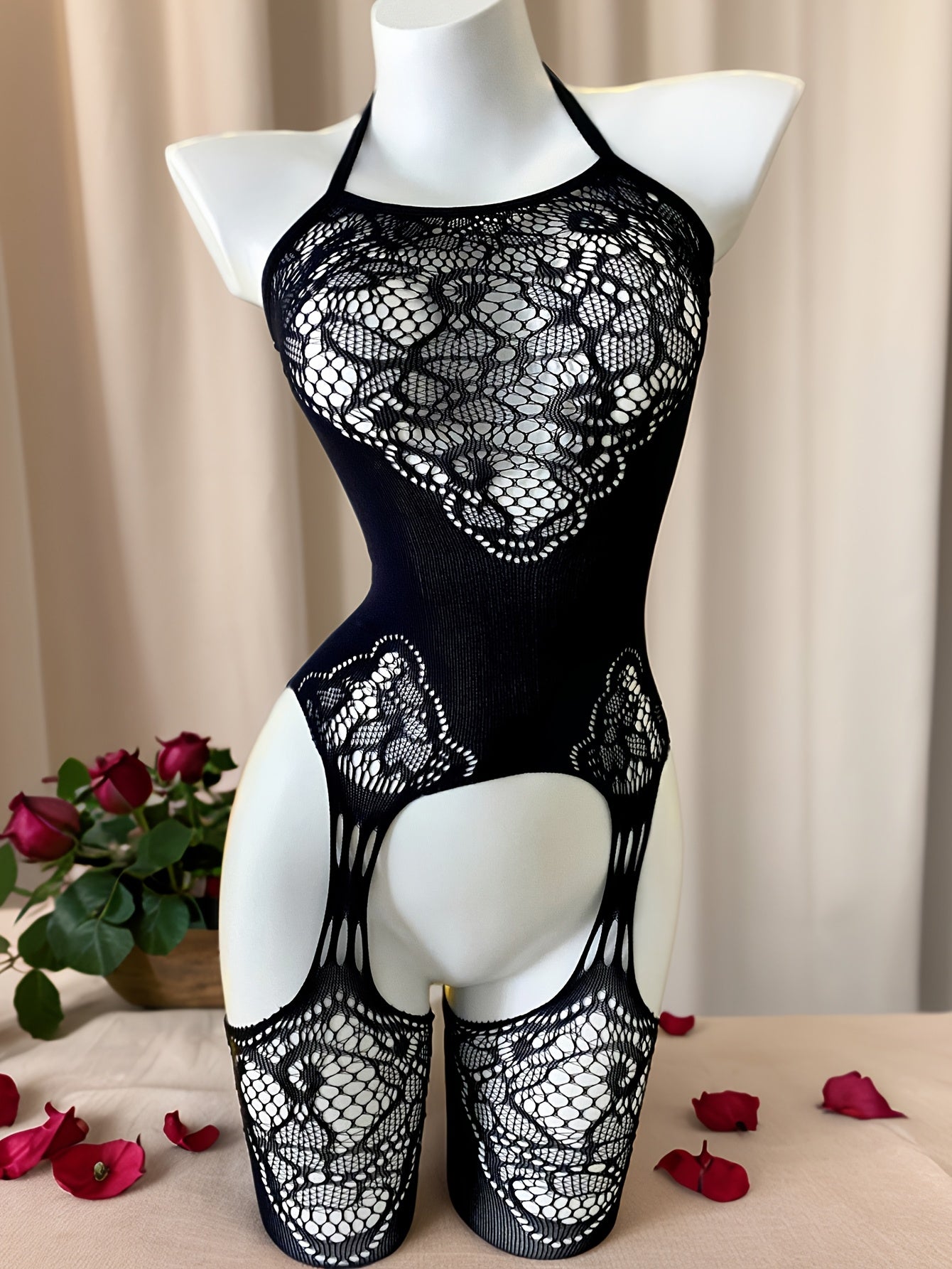 Stylish navy blue lace bodysuit with open crotch design, ideal for Valentine's Day and beachwear, made of sheer nylon/elastane blend, hand wash only.