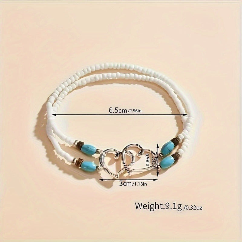 This elegant anklet set features two pieces with double hollowed-out heart shapes adorned with mini seed beads. The design exudes a Bohemian-style charm and is made with stretchy elastic for comfortable wear. A perfect gift for any beautiful woman.