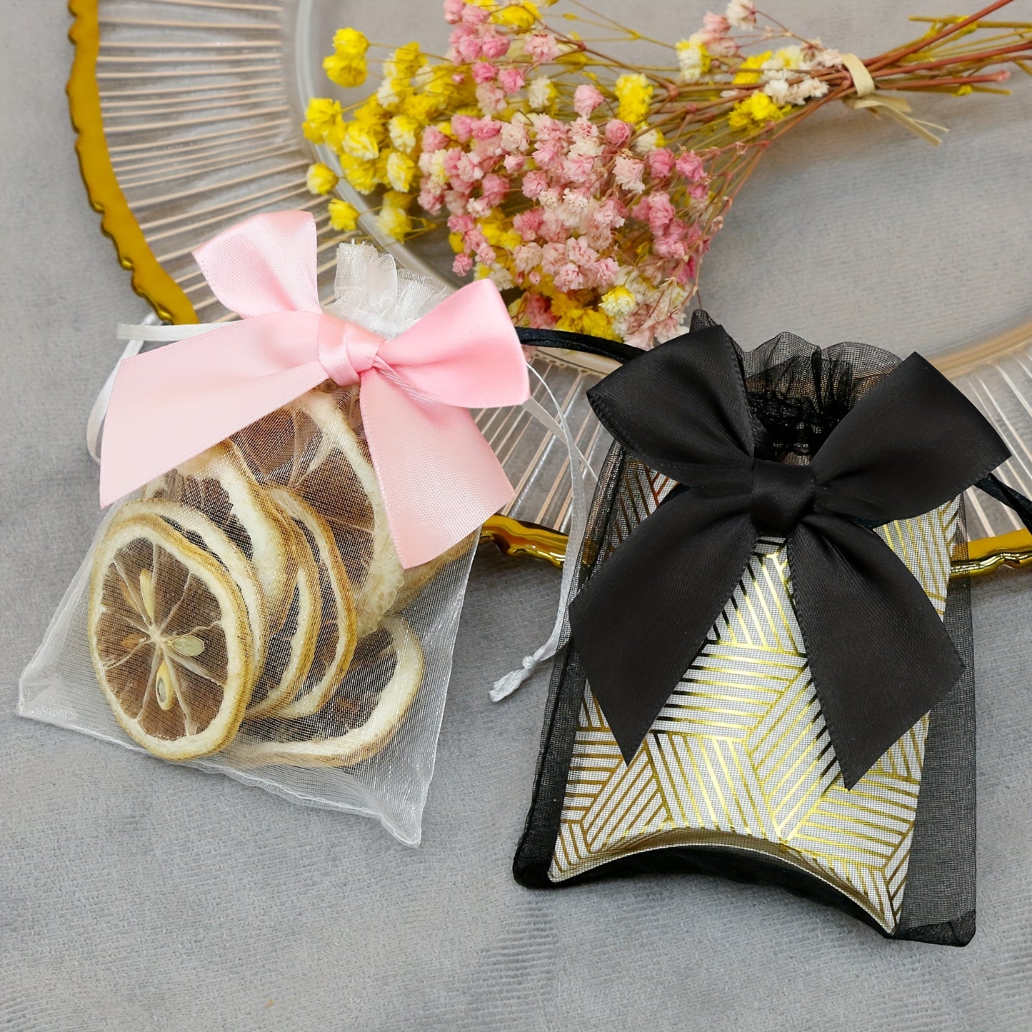 10 elegant organza bags with ribbon and bow, ideal for gift wrapping and party favors.