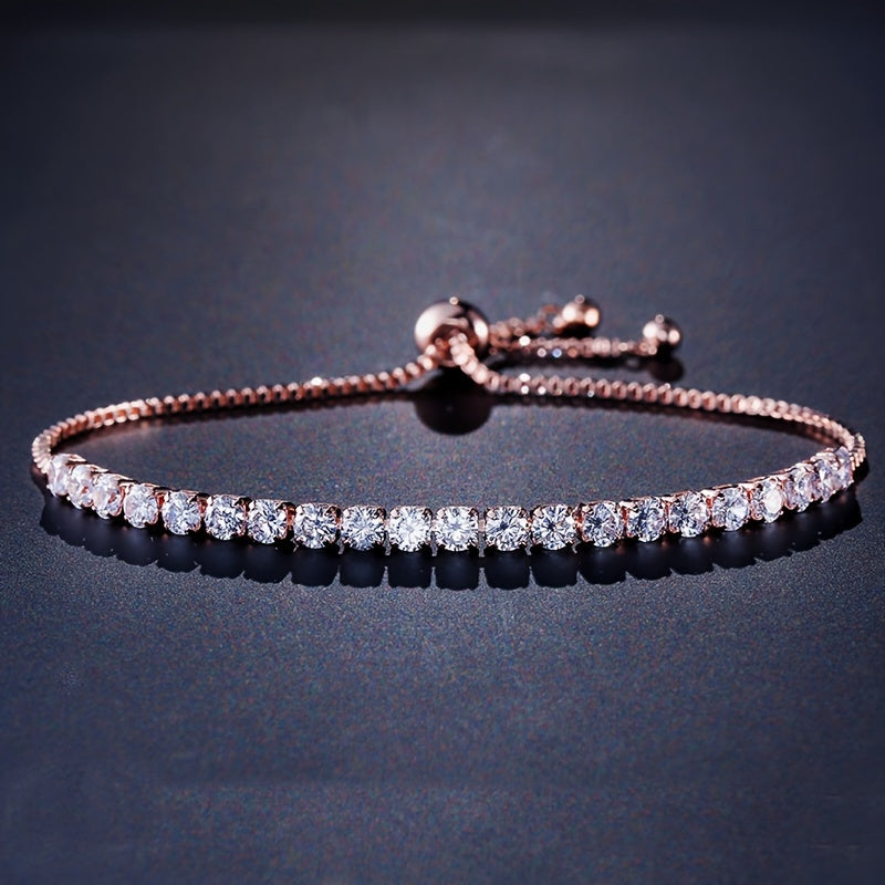 Stylish vintage-inspired cubic zirconia tennis bracelet with adjustable copper chain and sparkling rhinestones, ideal for parties or casual wear, great Valentine's Day gift.